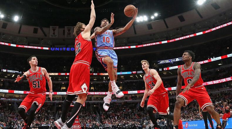 Jaylen Adams #10 of the Atlanta Hawks drives against (L-R) Ryan Arcidiacono #51, Robin Lopez #42, Lauri Markkanen #24 and Antonio Blakeney #9 of the Chicago Bulls at the United Center on March 03, 2019 in Chicago, Illinois. The Hawks defeated the Bulls 123-118.