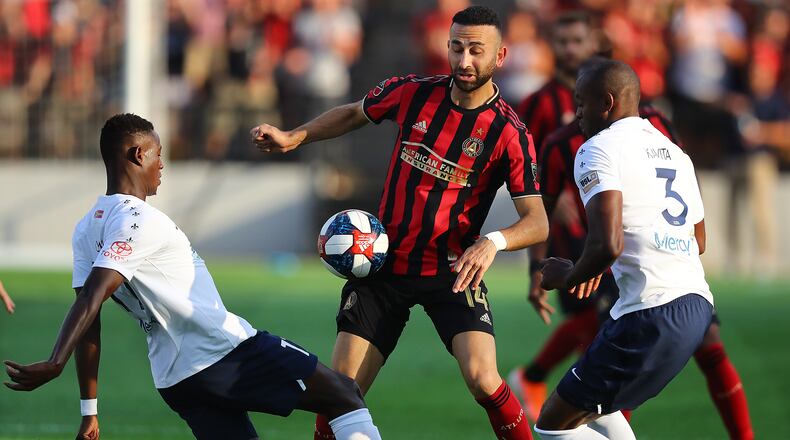 July 10, 2019 Kennesaw: Atlanta United Justin Meram defends against St. Louis players Oscar Umar (left) and Phanuel Kavita in a U.S. Open Cup quarterfinals soccer match on Wednesday, July 10, 2019, in Kennesaw.  Curtis Compton/ccompton@ajc.com