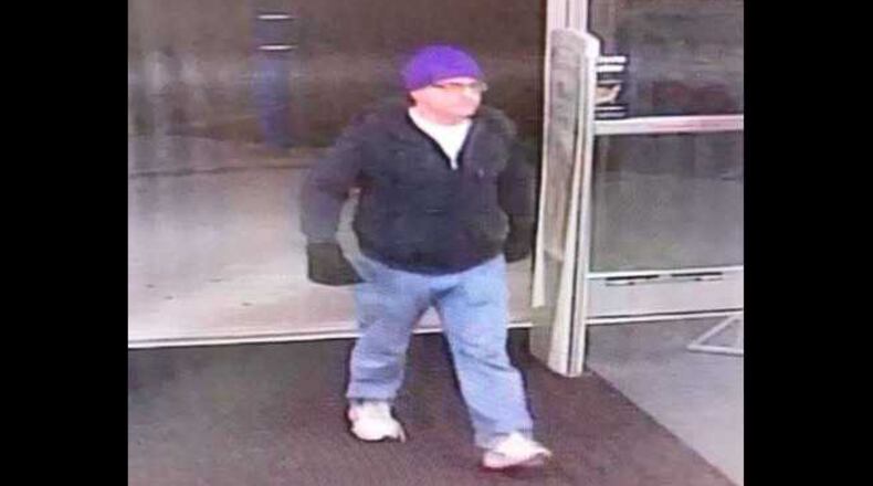 Kennesaw police say this man brandished a knife and demanded a CVS Pharmacy employee give him prescription drugs.