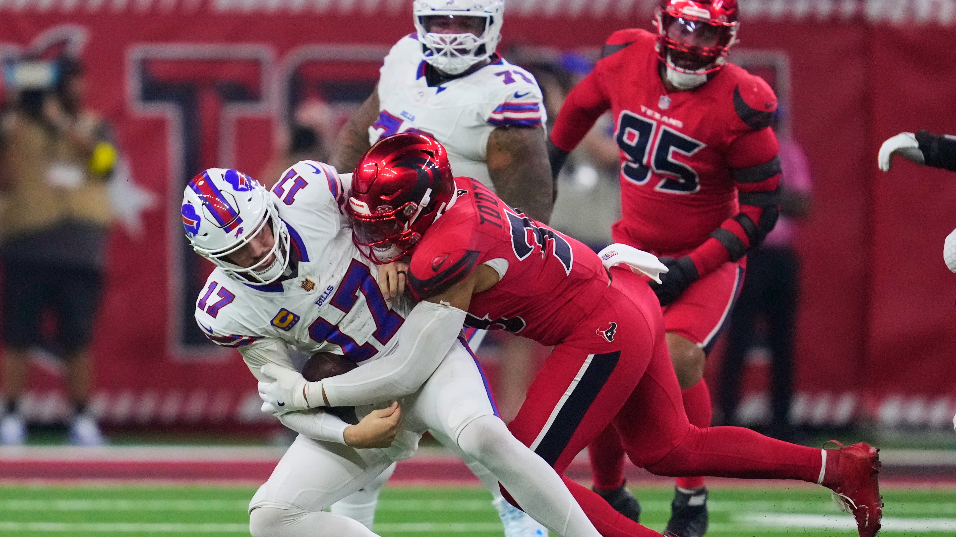 Buffalo Bills quarterback Josh Allen (17) is sacked by Houston Texans linebacker Henry To'oTo'o (39) in the second half of an NFL football game Thursday, Nov. 20, 2025, in Houston. (AP Photo/Ashley Landis)
