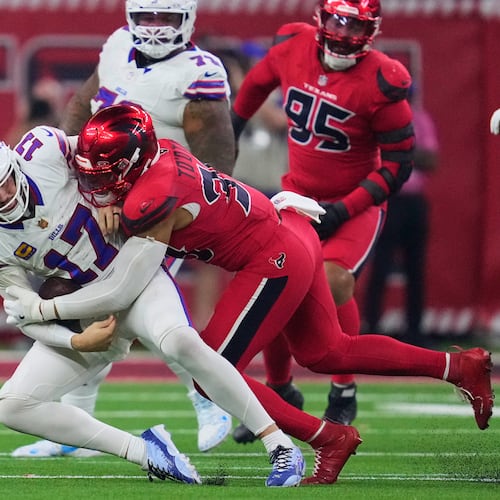 Buffalo Bills quarterback Josh Allen (17) is sacked by Houston Texans linebacker Henry To'oTo'o (39) in the second half of an NFL football game Thursday, Nov. 20, 2025, in Houston. (AP Photo/Ashley Landis)