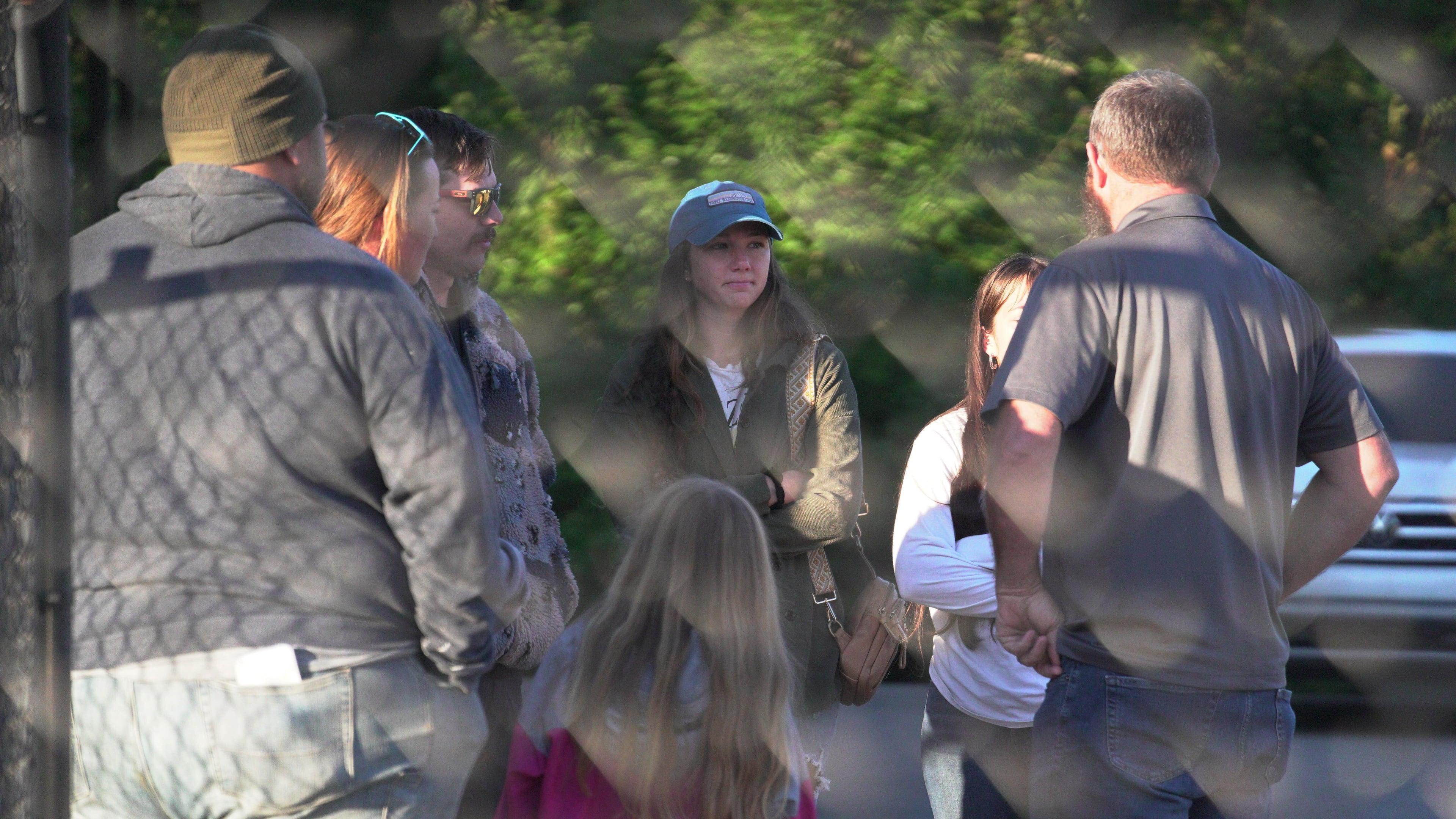 Family members gather at Accurate Energetic Systems, an explosive plant, after a blast on Friday resulted in multiple fatalities and several missing on Saturday, Oct 11, 2025, in Bucksnort, Tenn. (AP photo/ Obed Lamy)