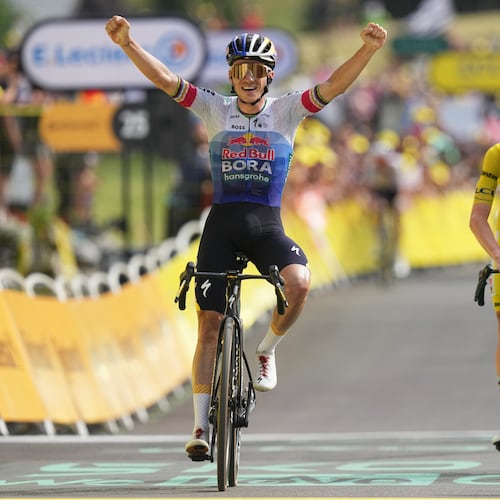 Belgium's Remco Evenepoel celebrates as he crosses the finish line ahead Slovenia's Tadej Pogacar to win the fifteenth stage of the Tour de France cycling race, from Champagnole to the Plateau de Solaison, France, Sunday, July 19, 2026. (AP Photo/Thibault Camus)