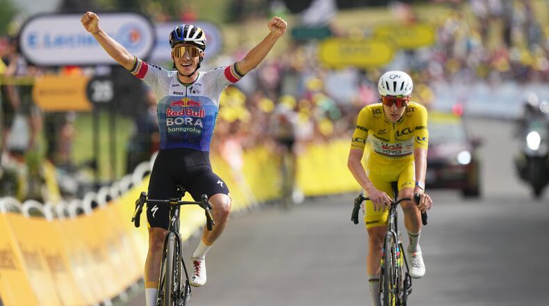 Belgium's Remco Evenepoel celebrates as he crosses the finish line ahead Slovenia's Tadej Pogacar to win the fifteenth stage of the Tour de France cycling race, from Champagnole to the Plateau de Solaison, France, Sunday, July 19, 2026. (AP Photo/Thibault Camus)