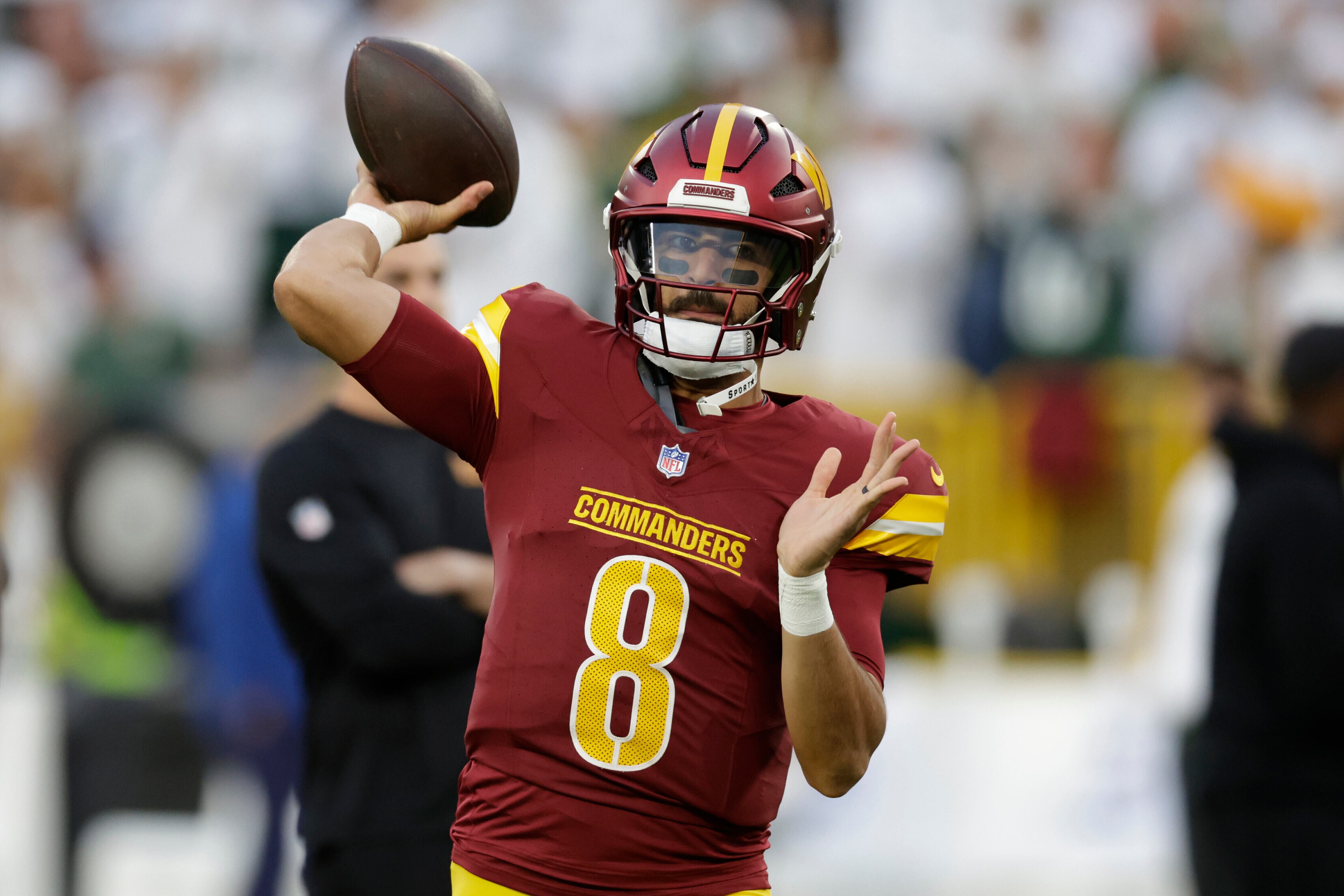 Washington Commanders quarterback Marcus Mariota warms up before a recent game.