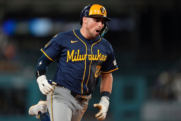 Milwaukee Brewers' Caleb Durbin celebrates as he rounds third after hitting a solo home run during the seventh inning of a baseball game against the Los Angeles Dodgers, Friday, July 18, 2025, in Los Angeles. (AP Photo/Mark J. Terrill)