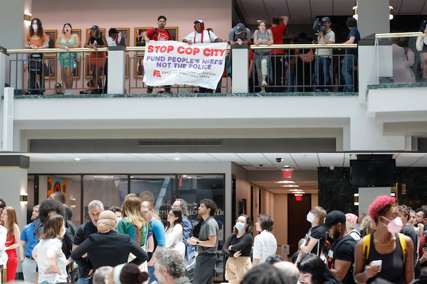 Protesters gather in the atrium of Atlanta City Hall to protest the proposed police training center on Monday, June 5, 2023. (Natrice Miller/AJC)
