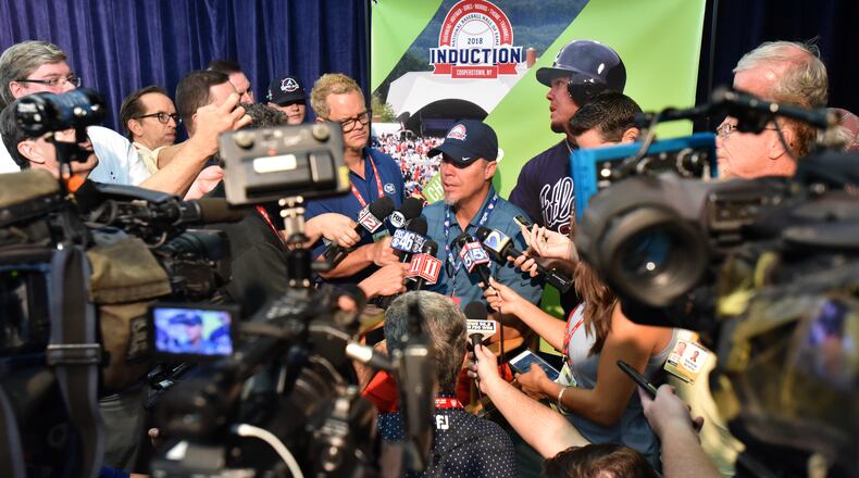 Chipper Jones talks about his busy week in Cooperstown with a few interested media types. (HYOSUB SHIN / HSHIN@AJC.COM)