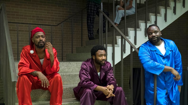 This image released by FX shows, from left, Lakeith Stanfield, Donald Glover and Brian Tyree Henry in a scene from the comedy series "Atlanta." The program was nominated for an Emmy on Thursday for outstanding comedy series. The 70th Emmy Awards will be held on Monday, Sept. 17.  (Guy D'Alema/FX via AP)