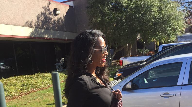 Kenya Moore briskly walks by the media this morning outside Sandy Springs municipal court. (The media really was just me and WSB-TV.) CREDIT: Rodney Ho/ rho@ajc.com