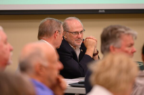 Challenger Steven Bartelski and EagleAI CEO Rick Richards present challenges to the Forsyth election board concerning the eligibility of 800 voters at the Forsyth County Voter Registrar in Cumming, Ga., on June 28, 2024. (Jamie Spaar for the AJC)