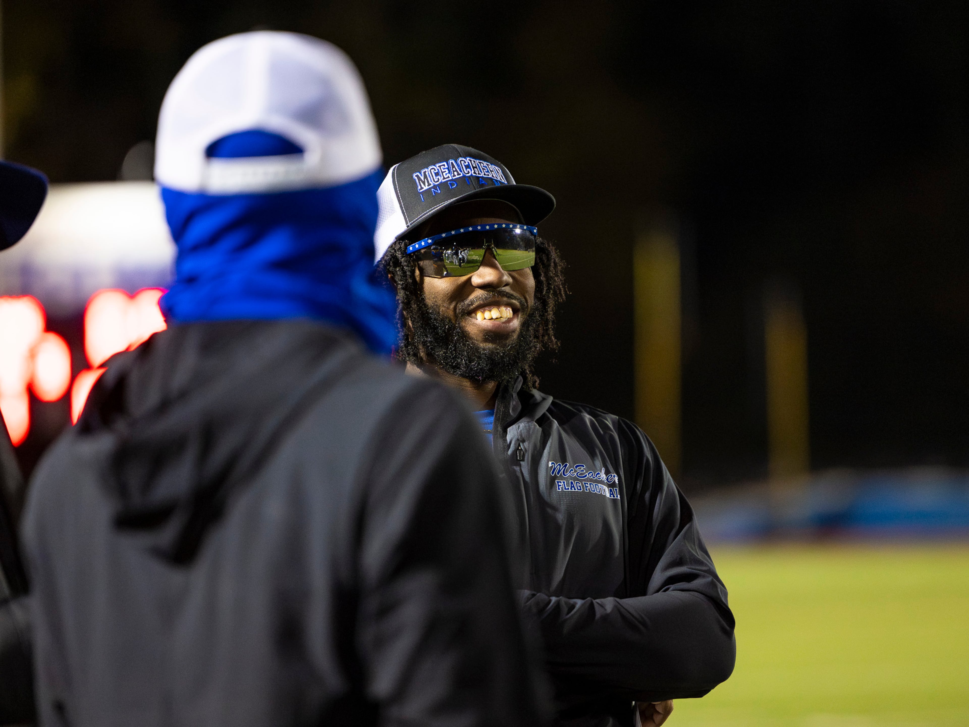 McEachern High School assistant coach Nigel Talton smiles at his coaching staff during a flag football game against Marietta at Osborne High School in Marietta on Monday, Nov. 17, 2025. (Oscar Guevara Saenz for the AJC)