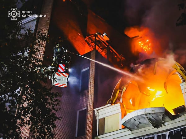 In this photo provided by the Ukrainian Emergency Service, firefighters put out a fire following Russia's massive air attack in Kharkiv, Ukraine, Friday, June 20, 2025. (Ukrainian Emergency Service via AP)