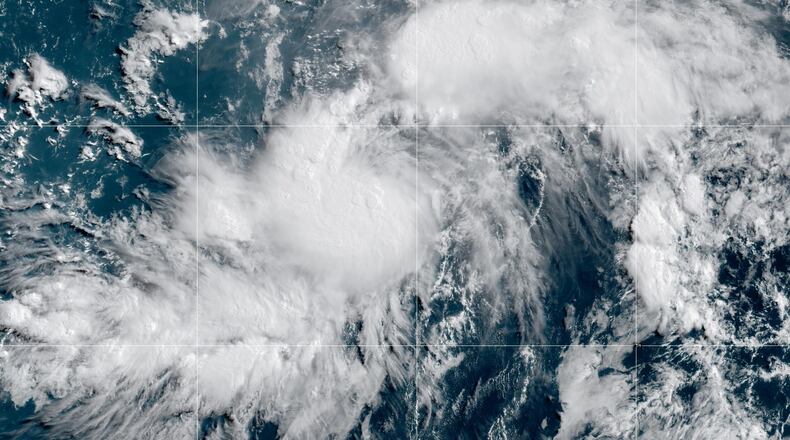 This GOES-19 GeoColor satellite image provided by NOAA shows Tropical Storm Genevieve in the Eastern Pacific on Friday, July 24, 2026. (NOAA via AP)