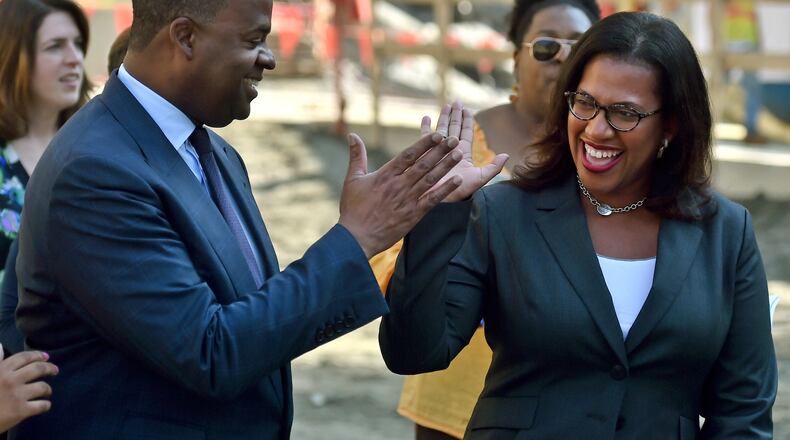 Mayor Kasim Reed gets a high five from Atlanta Watershed Commissioner Kishia L. Powell during ceremony to kick of the drilling of a tunnel used to create a reservoir that will give Atlanta a 60-day reserve water supply. A $11.6 million tunnel-boring machine, measuring over 400 feet long will dig a 5 mile tunnel to connect the quarry to the Chattahoochee River. The massive tunnel boring machine was officially named “Driller Mike” after Atlanta rapper and small business owner Driller Mike. BRANT SANDERLIN/BSANDERLIN@AJC.COM