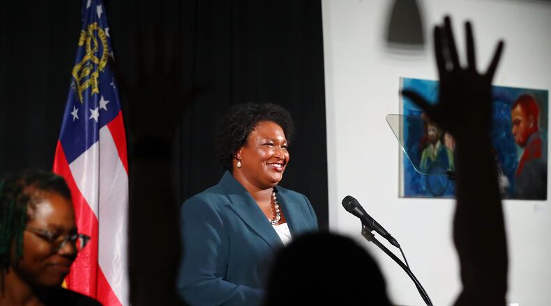 080922 Atlanta: A supporter waves as Democratic nominee for Governor Stacey Abrams concludes her economic address outlining her vision for Georgia’s economy on Tuesday, August 9, 2022, in Atlanta. “Curtis Compton / Curtis Compton@ajc.com