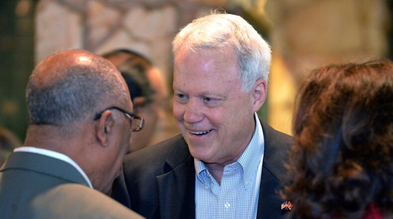 U.S. Senate candidate Rep. Paul Broun (center) talks with guests during the Boots, Blues and BBQ event hosted by the DeKalb GOP in Dunwoody on Saturday, May 10, 2014.