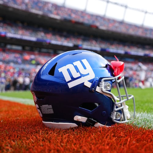 FILE - A New York Giants helmet is shown on the field before an NFL football game between the Denver Broncos and the Giants in Denver on Oct. 19, 2025. (AP Photo/Jack Dempsey, File)