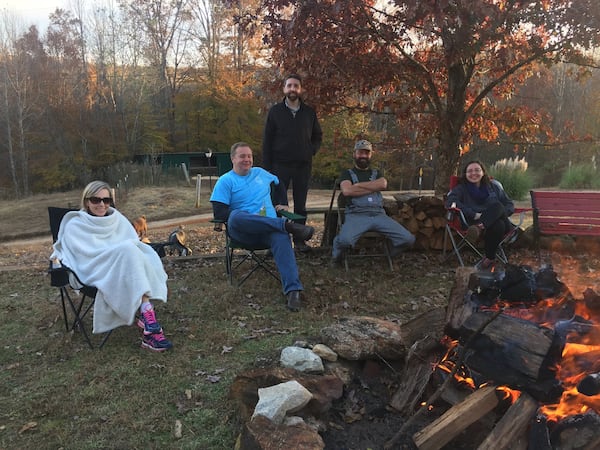 Family members sit around the bonfire at the Thanksgiving celebration hosted by Maggie and Richard Johnson. CONTRIBUTED BY JENNY ROBB-KING