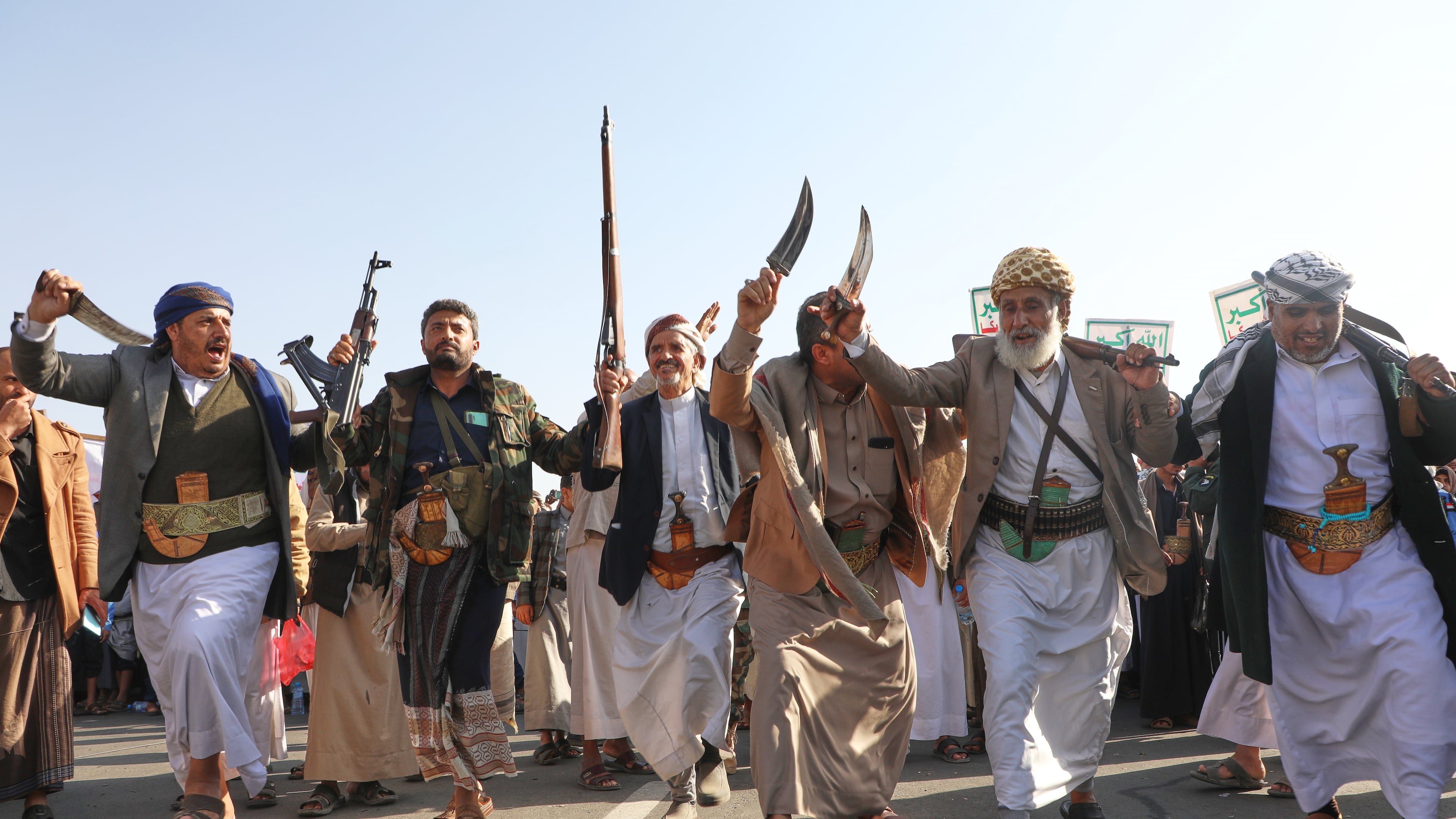 Houthi supporters dance as they celebrate following the announcement that Israel and Hamas have agreed to the first phase of a peace plan to pause the fighting, in Sanaa, Yemen, Friday, Oct. 10, 2025. (AP Photo/Osamah Abdulrahman)