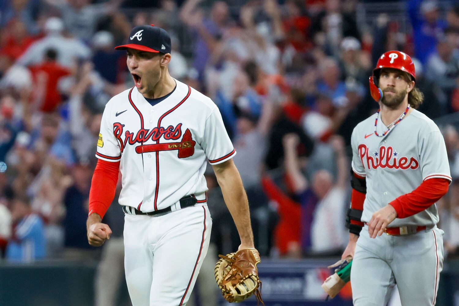 Atlanta Braves first baseman Matt Olson (28) reacts after forcing out Philadelphia Phillies’ Bryce Harper at first base on a fly out by Nick Castellanos to end the ninth inning of NLDS Game 2 in Atlanta on Monday, Oct. 9, 2023.   (Miguel Martinez / Miguel.Martinezjimenez@ajc.com)
