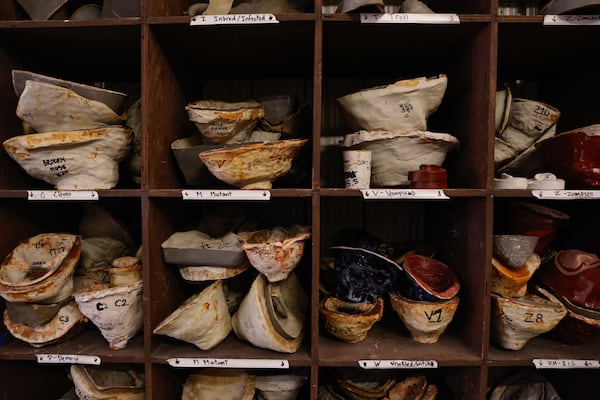 Masks and prosthetics are stored in the makeup studio at Six Flags Over Georgia. (Natrice Miller/AJC)