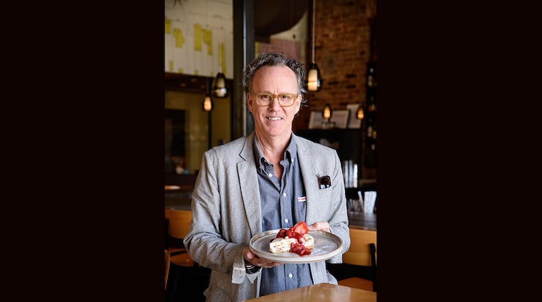 Rob Gentry, the owner of Hey Monty in Chattanooga, holds a slice of his no-bake MoonPie cheesecake. / Photo by Mark Gilliland