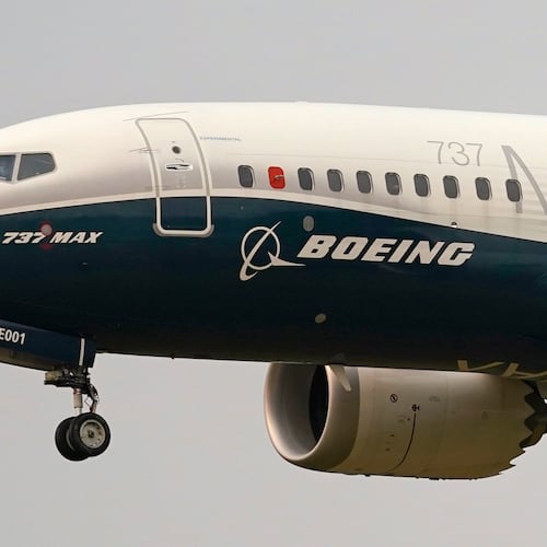FILE - A Boeing 737 Max jet prepares to land at Boeing Field following a test flight in Seattle, Sept. 30, 2020. (AP Photo/Elaine Thompson, File)