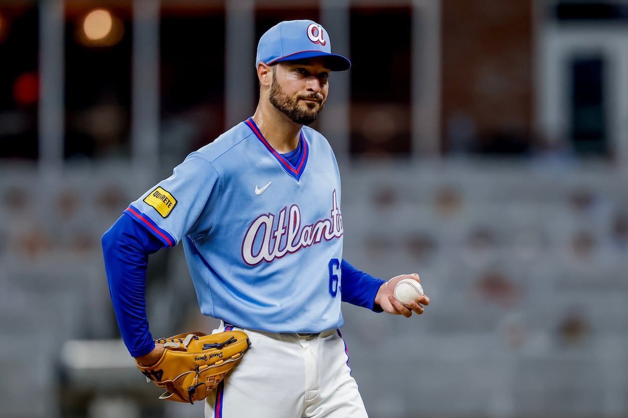Atlanta Braves pitcher Danny Young (63) reacts after giving up a three-run home run to Arizona Diamondbacks' Tim Tawa during the ninth inning of a baseball game, Saturday, Aug. 15, 2026, in Atlanta. (AP Photo/Erik S. Lesser)