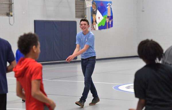 Aidan Anderson plays with kids at Samuel L. Jones Boys & Girls Club in Decatur. HYOSUB SHIN / HSHIN@AJC.COM