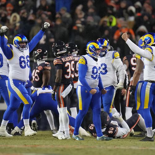 Los Angeles Rams kicker Harrison Mevis, center, reacts with holder Ethan Evans, center right, and teammates after booting a game-winning field goal during overtime of an NFL football divisional playoff game Sunday, Jan. 18, 2026, in Chicago. (AP Photo/Jeff Roberson)
