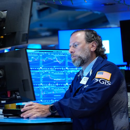 Michael Pistillo works on the floor at the New York Stock Exchange in New York, Monday, July 6, 2026. (AP Photo/Seth Wenig)