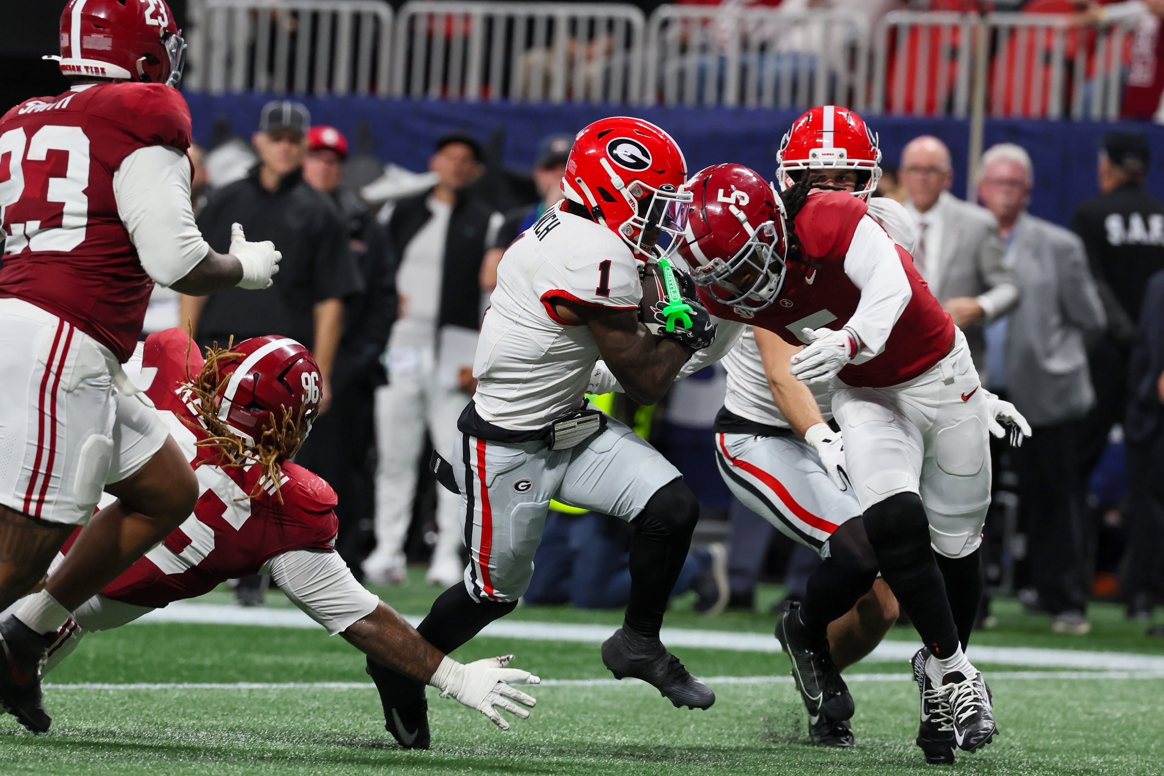 Georgia wide receiver Zachariah Branch (1) scores a touchdown after a 13 yard pass reception against Alabama during the fourth quarter of the SEC Championship game at Mercedes-Benz Stadium, Saturday, Dec. 6, 2025, in Atlanta. (Jason Getz / AJC)