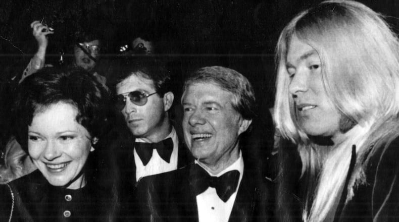 Jan. 19, 1977 - President-elect Jimmy Carter and wife Rosalynn say hello to an old friend at Gala. Rock musician Gregg Allman was one of the performers at the Kennedy Center show. (AP) 1977