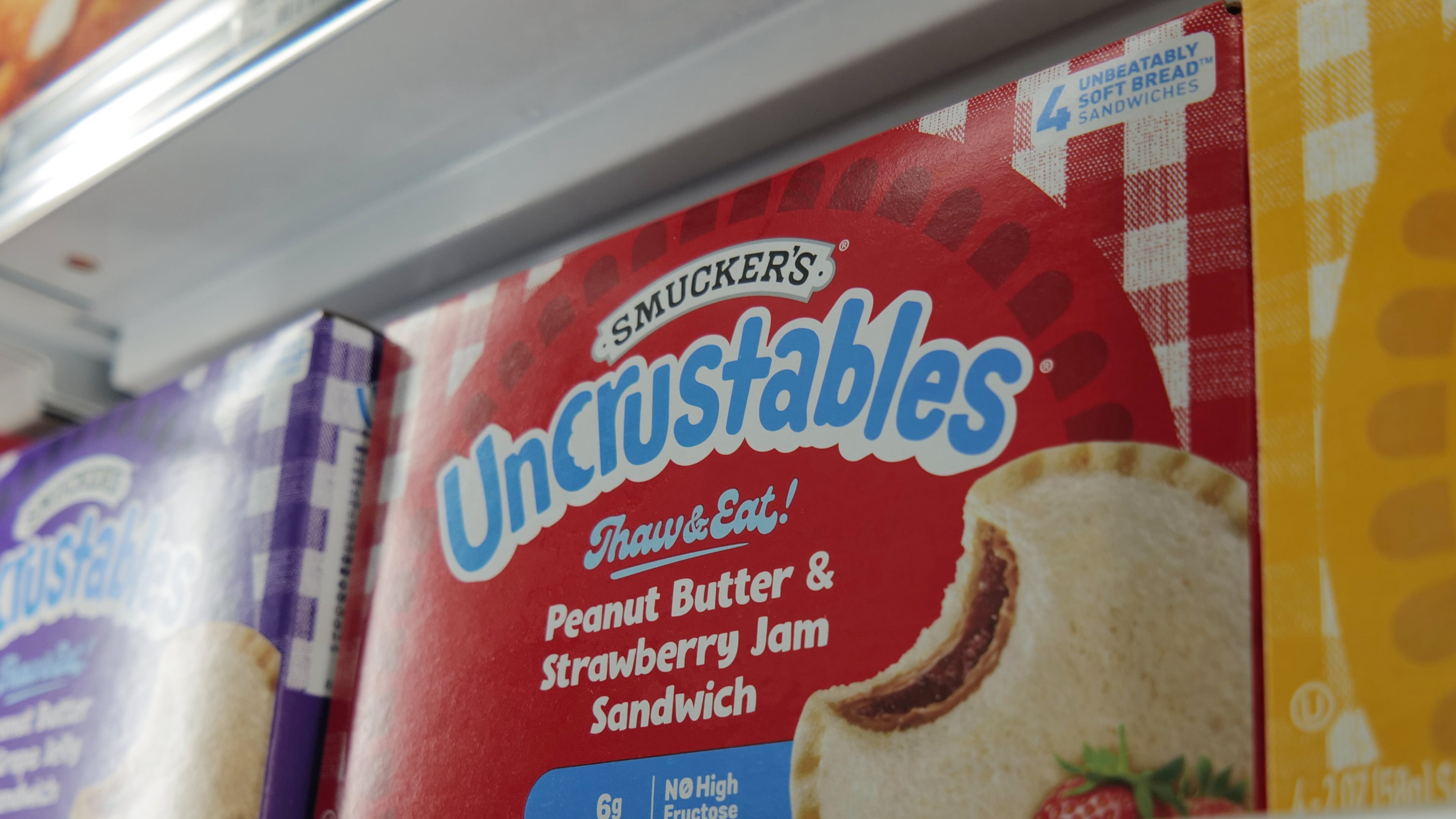 A box of Smucker's Uncrustables sandwiches are seen in a freezer of a supermarket in New York on Wednesday, Oct. 15, 2025. (AP Photo/Patrick Sison)
