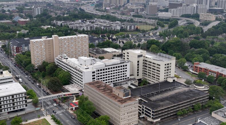 Aerial photo shows Wellstar Atlanta Medical Center as Grady Memorial Hospital is shown in backgound, Wednesday, April 26, 2023, in Atlanta. Wellstar closed Atlanta Medical Center on Nov. 1, 2022. Wellstar has said it closed the AMC hospitals because it was not financially feasible to keep them open, despite millions in improvements. (Hyosub Shin / Hyosub.Shin@ajc.com)