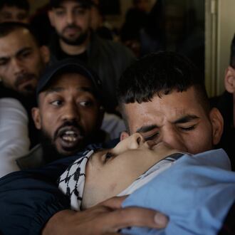 Palestinians mourn during the funeral of Hassan Ahmed Jamil Moussa,19, who, according to health authorities, was killed during an Israeli raid last night in Askar camp near the West Bank city of Nablus, Sunday, Nov. 16, 2025. (AP Photo/Majdi Mohammed)