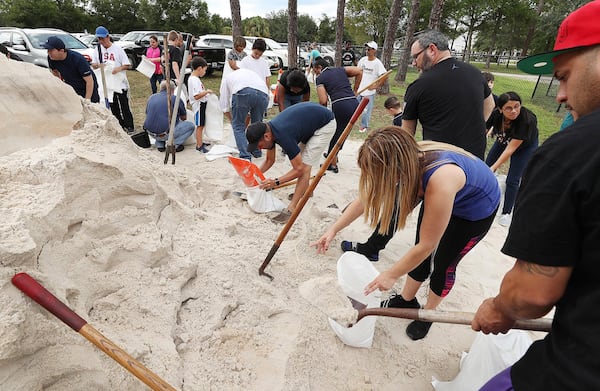 Dozens of Orange County residents fill sandbags at Blanchard Park in Orlando, Fla., on Wednesday, Aug. 28, 2019. The sandbags are being offered in advance of Hurricane Dorian, which is forecast to likely hit Florida. 