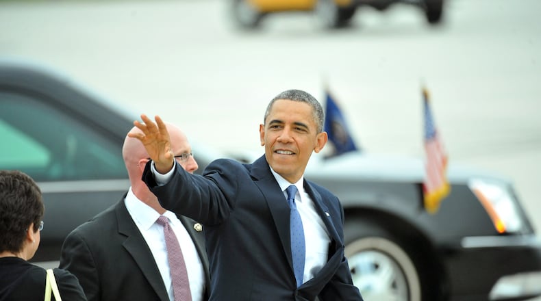 May 19, 2013 Atlanta - United States President Barack Obama leaves after he greeted members of a crowd gathered to greet him at Hartsfield-Jackson Atlanta International Airport on Sunday, May 19. President Obama visits Atlanta on Sunday to give a commencement speech at Morehouse and raise money for the Democratic Senatorial Campaign Committee at Arthur Blank's house. HYOSUB SHIN / HSHIN@AJC.COM President Barack Obama visits Atlanta in 2013 (AJC/Hyosub Shin)