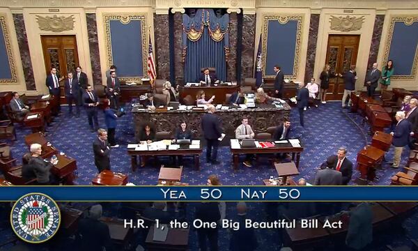 In this image from video from Senate Television, Vice President JD Vance, seated center, breaks a 50-50 tie to push President Donald Trump’s big tax breaks and spending cuts bill over the top, on the Senate floor at the U.S. Capitol, Tuesday, July 1, 2025, in Washington. (Senate Television via AP)