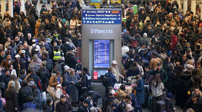 Travelers queue for Eurostar services at St Pancras International station in London, Tuesday, Dec. 30, 2025. (AP Photo/Alberto Pezzali)