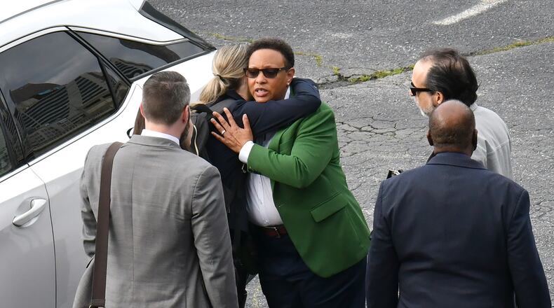 March 23, 2022 Atlanta - Mitzi Bickers hugs her attorney Marissa Goldberg as she leaves after her trial in federal court at the Richard B. Russell Federal Building on Wednesday, March 23, 2022. A federal jury has found Mitzi Bickers guilty of nine charges in the first trial in the Atlanta City Hall corruption investigation. (Hyosub Shin / Hyosub.Shin@ajc.com)