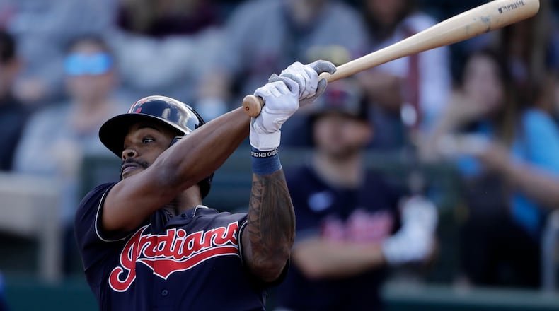 Cleveland Indians' Delino DeShields bats during the third inning of a spring training baseball game against the Kansas City Royals Sunday, Feb. 23, 2020, in Surprise, Ariz. (AP Photo/Charlie Riedel)