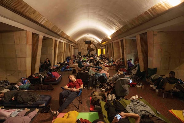People sleep on the platform of a metro station as they take cover during a Russian attack on Kyiv, Ukraine, on Thursday, July 10, 2025. (AP Photo/Evgeniy Maloletka)