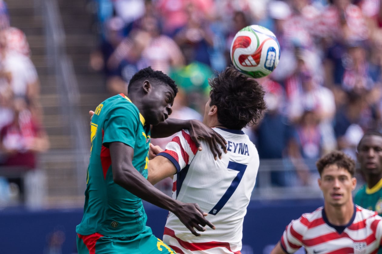 Senegal midfielder Bara Ndiaye (left) and United States midfielder Giovanni Reyna (7) head the ball during the first half of an international friendly Sunday, May 31, 2026, in Charlotte, North Carolina. (Scott Kinser/AP)