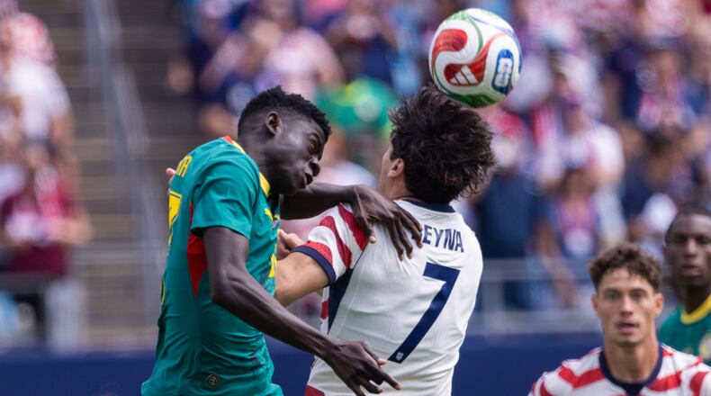 Senegal midfielder Bara Ndiaye (left) and United States midfielder Giovanni Reyna (7) head the ball during the first half of an international friendly Sunday, May 31, 2026, in Charlotte, North Carolina. (Scott Kinser/AP)