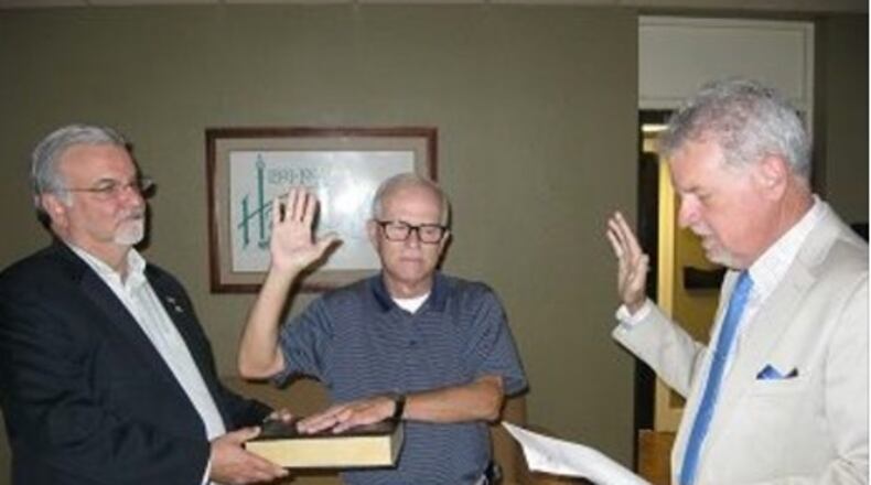 Left to right: Hapeville mayor Alan Hallman; Mike Rast; and city attorney Steven Fincher at Rast’s June 7 swearing-in. Credit: City of Hapeville Facebook page.