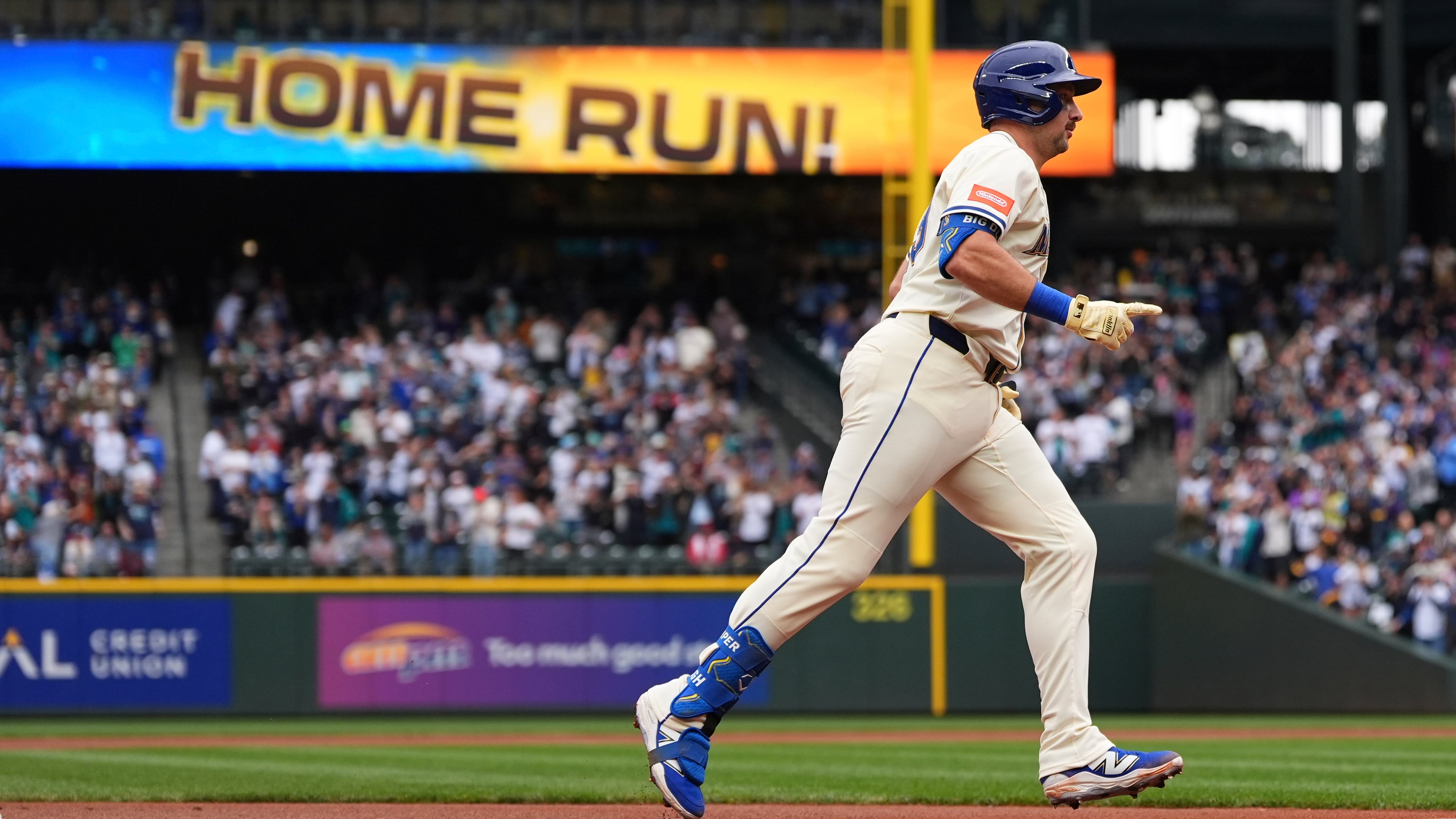 Seattle Mariners' Cal Raleigh jogs the bases after hitting his 54th home run of the season, a two-run home run to tie Mickey Mantle for most home runs by a switch-hitter in a single season, against the Los Angeles Angels during the first inning of a baseball game Sunday, Sept. 14, 2025, in Seattle. (AP Photo/Lindsey Wasson)