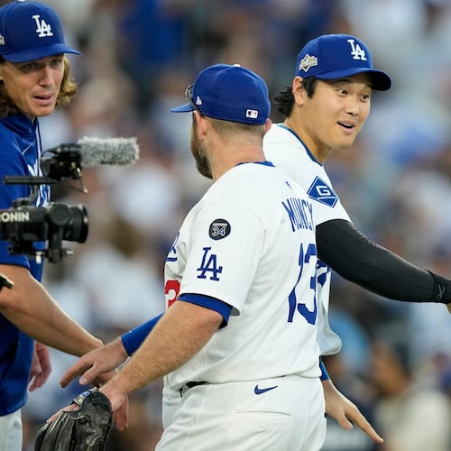 Los Angeles Dodgers' Shohei Ohtani celebrates their win against the Milwaukee Brewers in Game 3 of baseball's National League Championship Series, Thursday, Oct. 16, 2025, in Los Angeles. (AP Photo/Brynn Anderson)