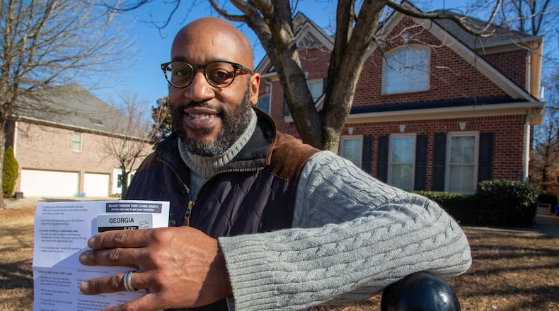 Cobb parent Kennall Mond was surprised to receive federal pandemic benefits in the mail for his two elementary students who usually would not qualify for the assistance. (Steve Schaefer for The Atlanta Journal-Constitution)